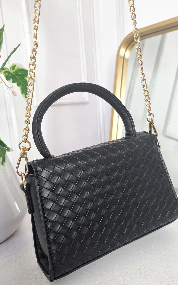 Faux Leather Quilted Handbag with gold chain accents, featuring a structured design and quilted texture, ideal for transitioning from day to night.