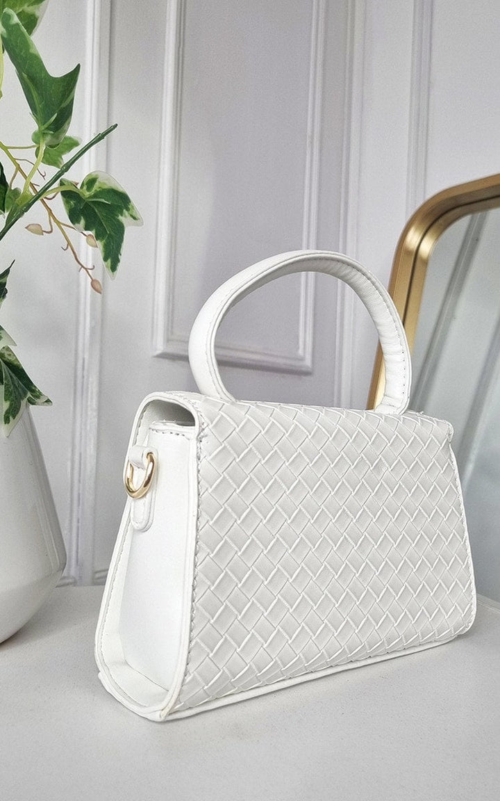 Faux Leather Quilted Handbag on a table, showcasing its structured, stylish design and comfortable quilted texture, perfect for versatile day-to-night wear.