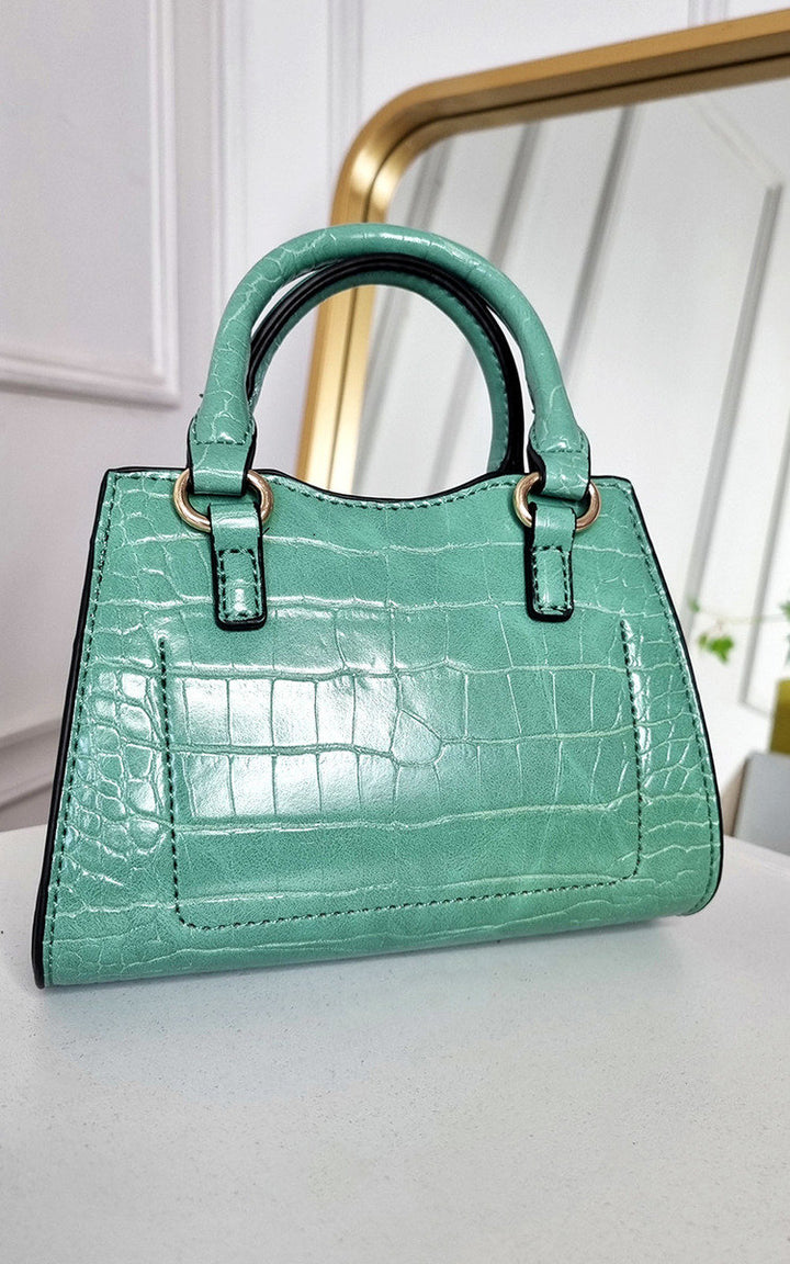 Croc Print Handbag on display, showcasing its chic faux leather design with ample space for essentials, ideal for stylish outings.