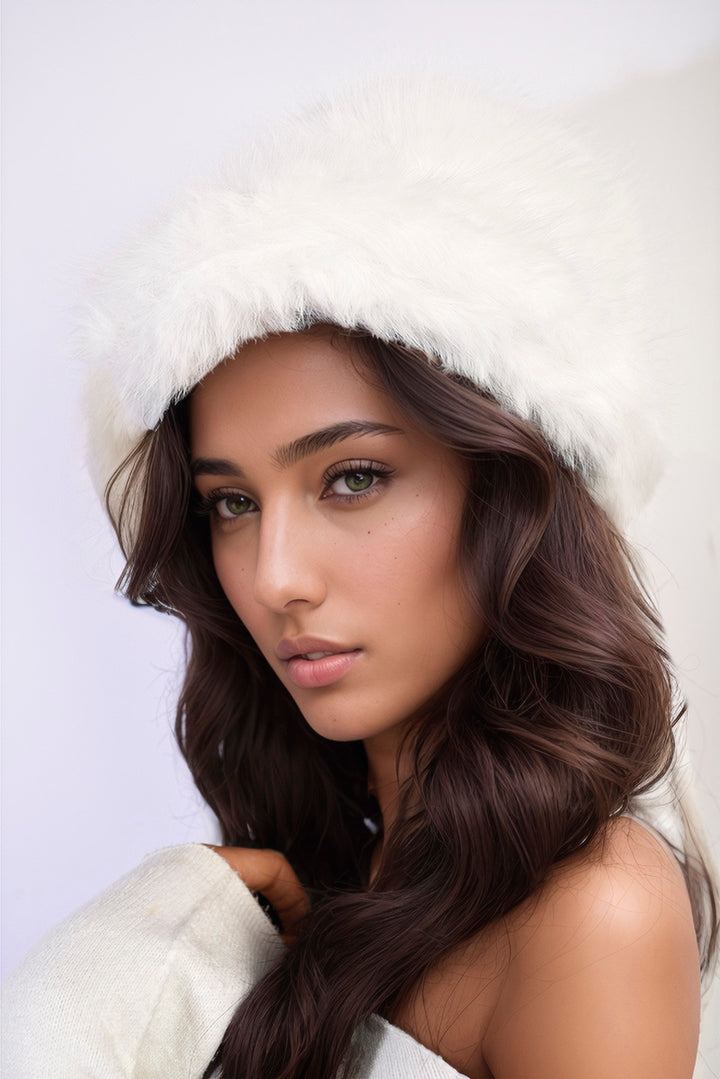 Woman wearing the Ashley Fluffy Faux Fur Winter Hat, showcasing its stylish, fluffy texture perfect for winter warmth and fashion.