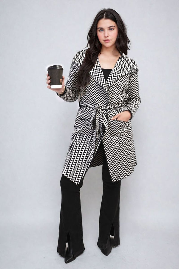 Woman holding a coffee cup, wearing the Check Print Full Sleeve Notched Lapel Collar Neck Belted Coat, showcasing its stylish check pattern and elegant belted design.