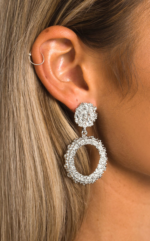 Statement Vintage Earrings with raised effect seen on a woman's ear, featuring post backings, embodying a bold, vintage style perfect for standout fashion moments.