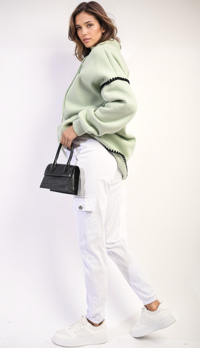 Woman wearing Drawstring Waist Cargo Joggers, showcasing a stylish blend of comfort and functionality with drawstring waist and cargo pockets, holding a black purse.