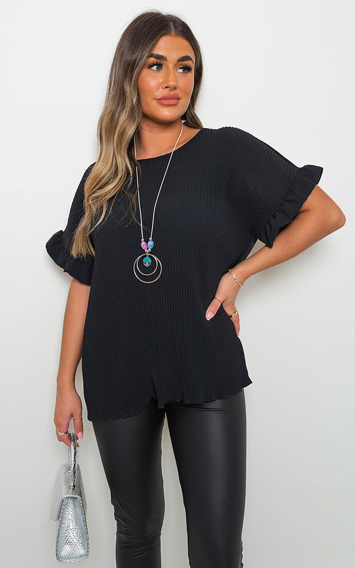 Frill Sleeve Top With Chain showcased on a woman, highlighting its frill sleeves and stylish chain, epitomizing chic elegance from Holiday Clothes UK.