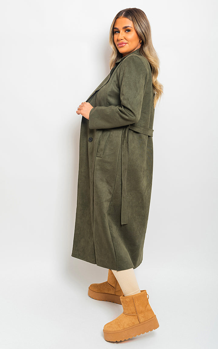 Woman wearing an Open Front Lapel Neck Longline Trench Coat, showcasing its stylish, versatile design and longline silhouette, paired with brown boots for a chic look.