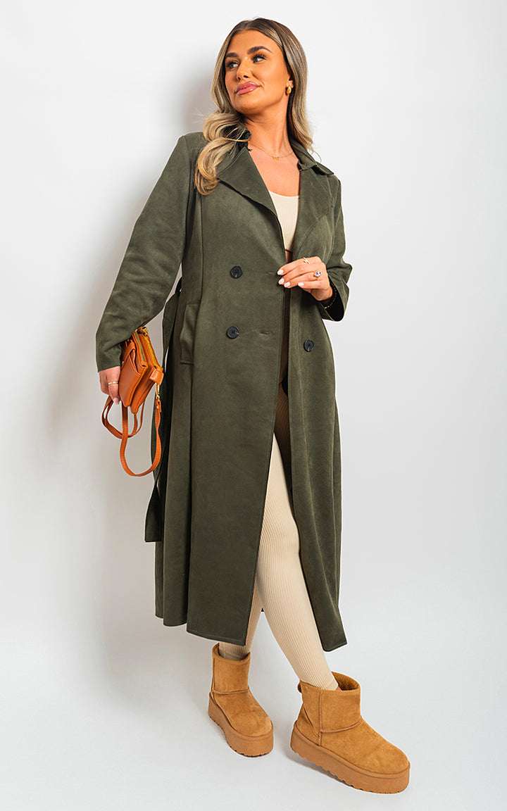 Woman wearing an Open Front Lapel Neck Longline Trench Coat, styled with brown boots and holding a purse, showcasing chic outerwear from Holiday Clothes UK.