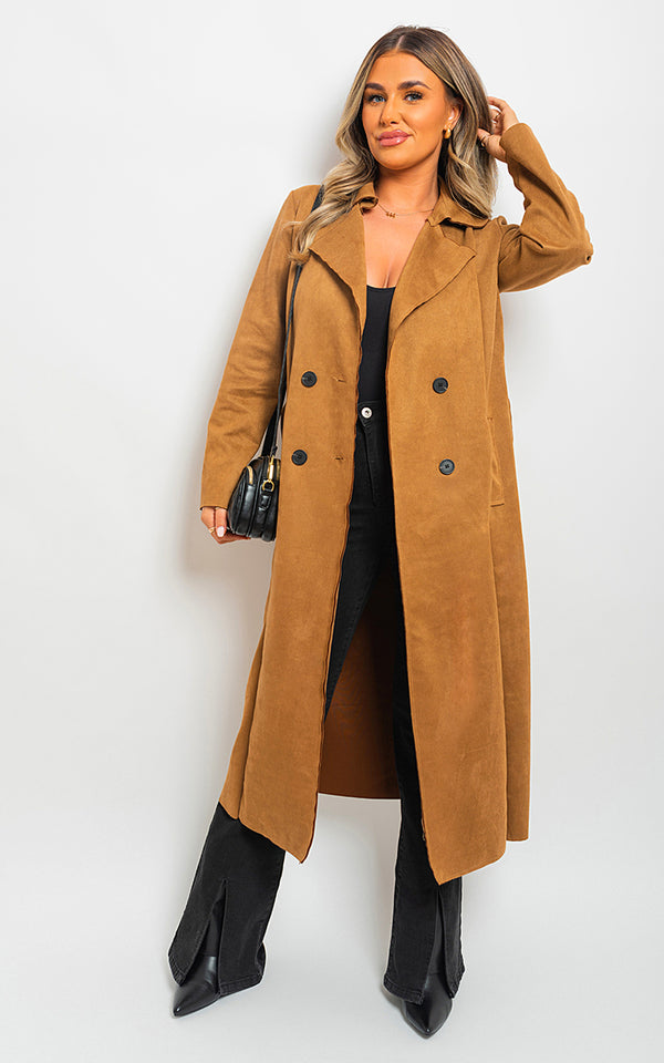 Woman wearing an Open Front Lapel Neck Longline Trench Coat, showcasing its elegant design and functional features, including a black bag accessory.