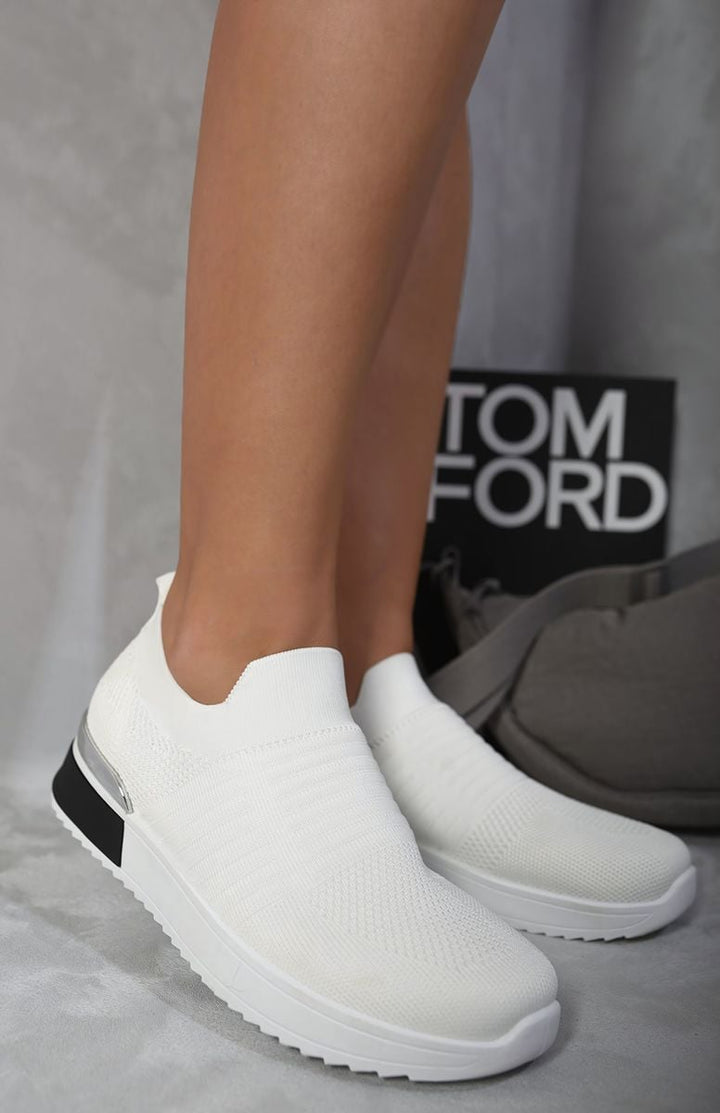 Slip On Sock Wedge Trainers showcasing a stylish and comfortable sock-like fit with a modern wedge design, ideal for casual outings.