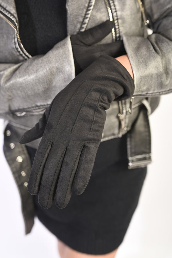 Close-up of a person wearing the Blake Winter Suede Gloves, showcasing their luxurious suede texture and elegant design, ideal for stylish winter outings.