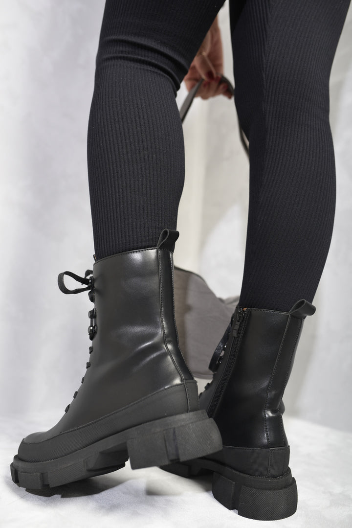 Chunky Platform Lace-Up Ankle Boots showcasing a vintage-modern design with chunky soles and lace-up details, perfect for adding edge to any outfit.