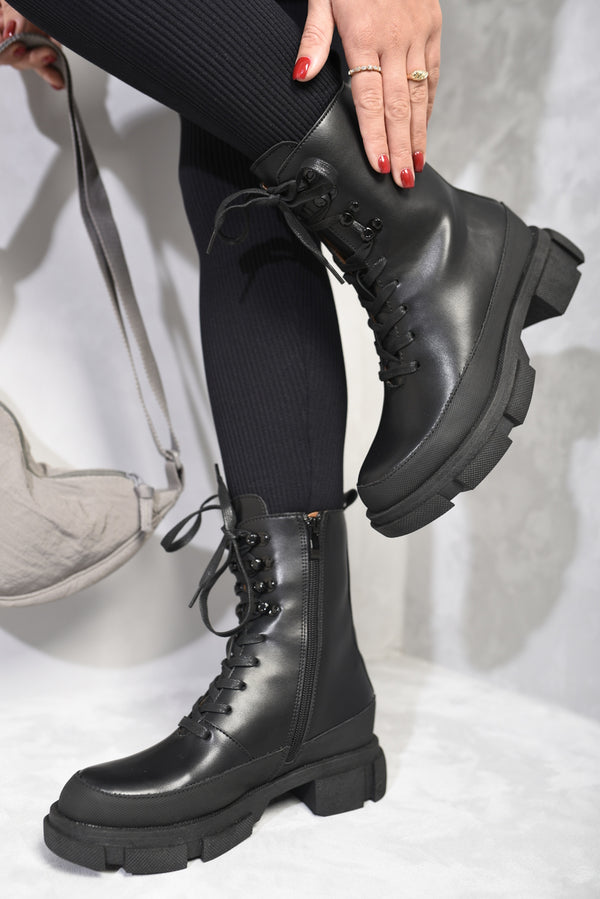 Chunky Platform Lace-Up Ankle Boots with a modern chunky platform and traditional lace-up design, ideal for adding an edgy touch to outfits.