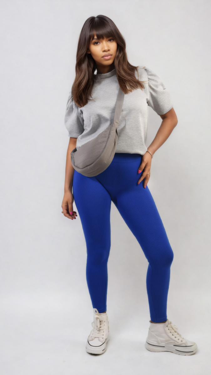 Woman showcasing Braylee High Waisted Wide Band Leggings, highlighting their supportive fit and flexibility, ideal for activewear and casual wear.