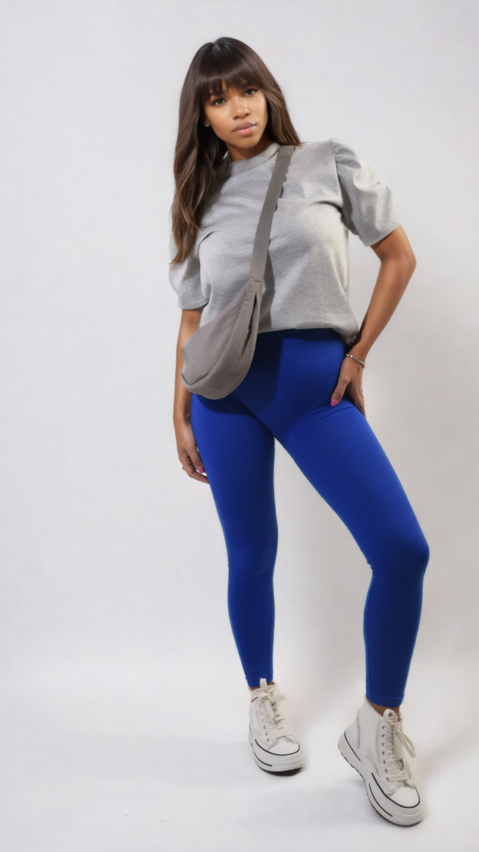 Woman wearing Braylee High Waisted Wide Band Leggings and grey shirt, showcasing supportive design ideal for active or casual wear.