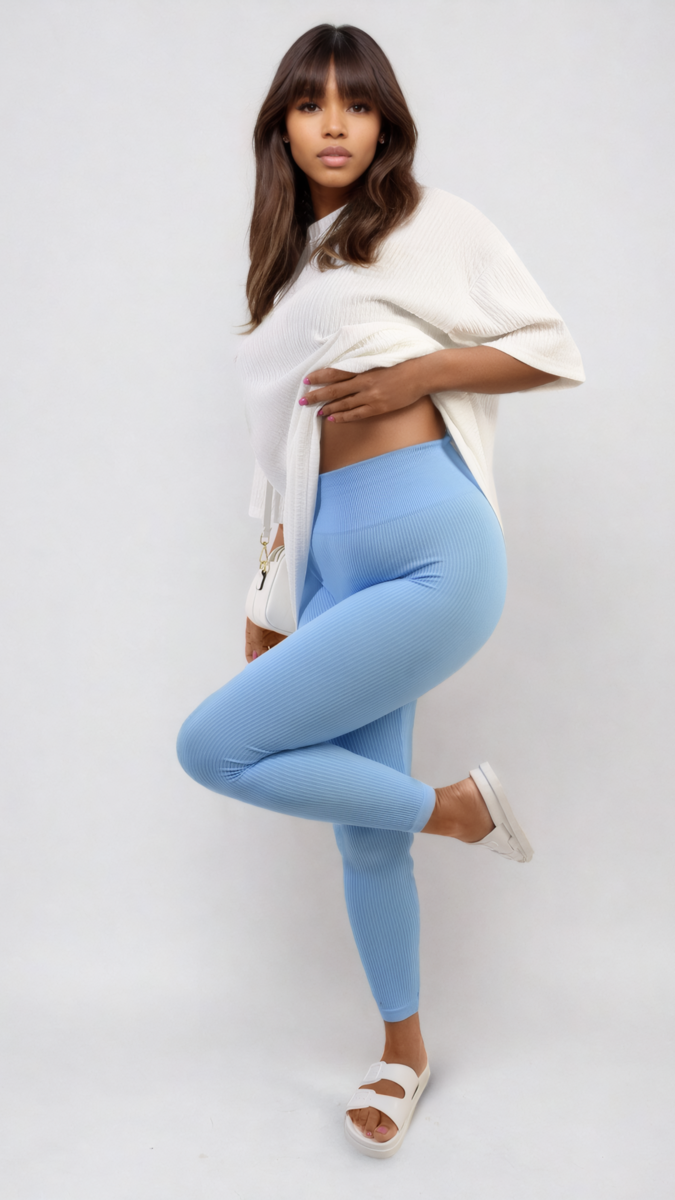 Woman wearing Braylee High Waisted Wide Band Leggings with a white shirt, showcasing the supportive and flattering fit ideal for active or casual wear.