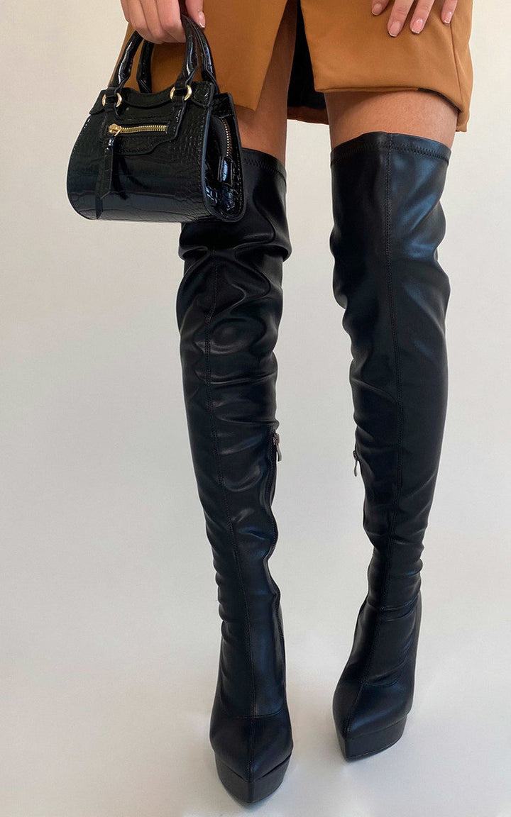 Knee High Pointed Heel Boots with Zip Detail, featuring sleek design and zip accents, worn with shorts, showcasing a stylish, versatile look for any occasion.