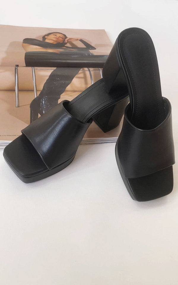 Block high heels with a sleek design, perfect for pairing with a bodycon dress for glam occasions. Ideal for stylish versatility and comfort.