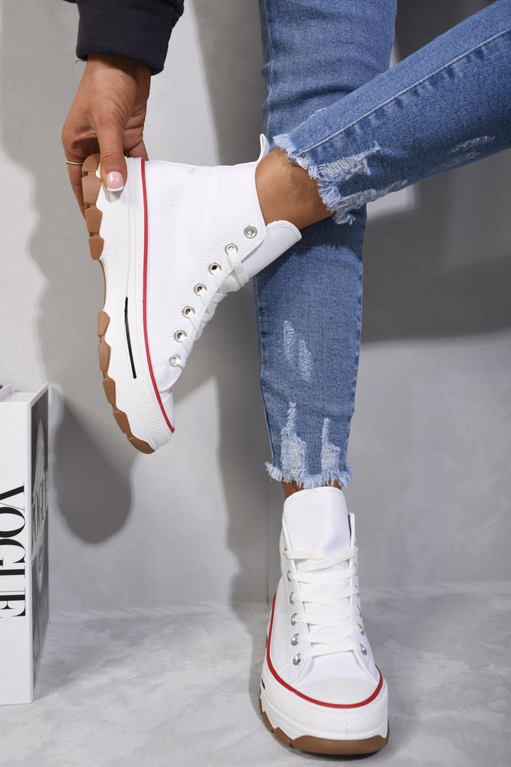 High Top Platform Lace Up Trainers being worn with jeans, showcasing their high-top design and platform sole for added style and comfort.