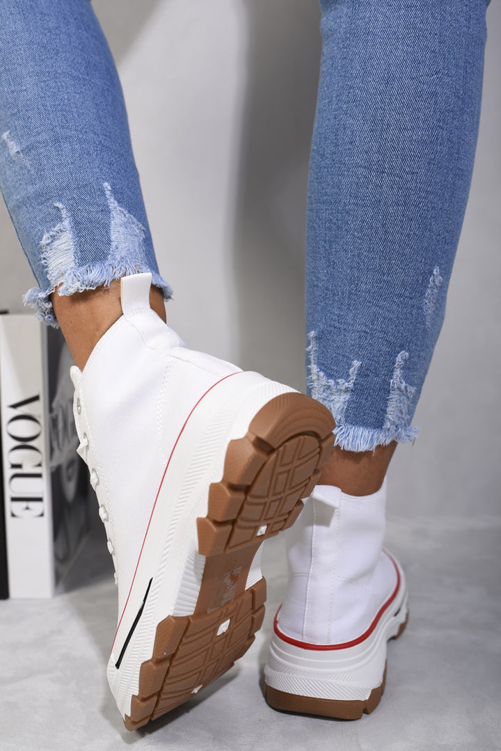 High Top Platform Lace Up Trainers showcased with ripped jeans, highlighting their stylish high-top design and comfortable platform sole.