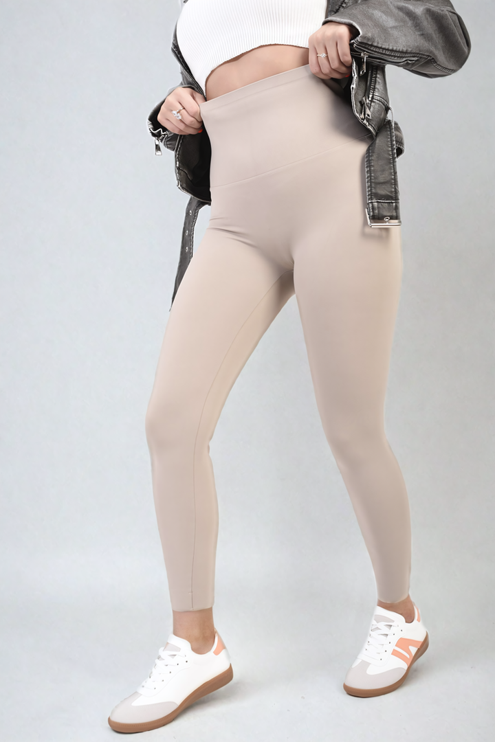 Woman in High Waist Wide Waistband Leggings with leather jacket, highlighting seamless shading and contouring patterns, perfect for stylish workouts or casual outings.