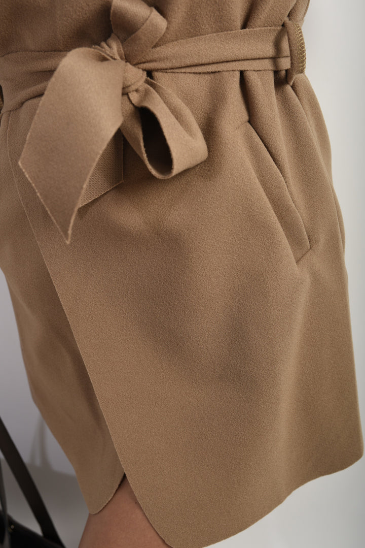 Close-up of the Wide Lapel Sleeveless Belted Jacket, showcasing its chic wide lapel and belted waist design, perfect for stylish layering.