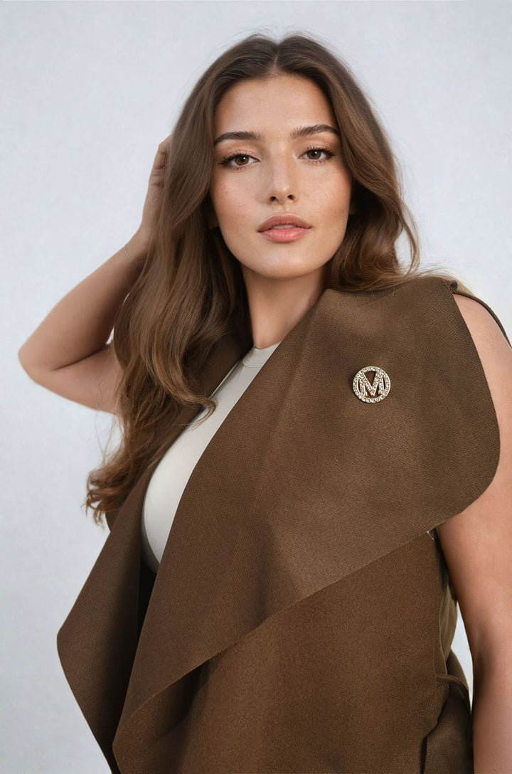 Woman wearing a Wide Lapel Sleeveless Belted Jacket, showcasing its stylish design with a flattering silhouette, ideal for layering.