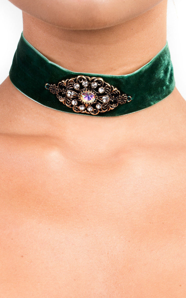 Velvet Jewelled Choker featuring green velvet fabric with a central jeweled detail, shown on a neck for a stylish, 90s-inspired accessory.