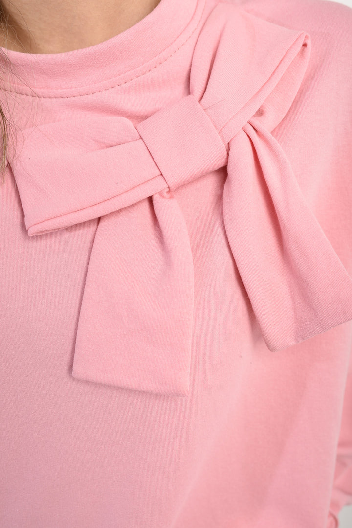 Close-up of the Carina Long Sleeve Bow Detail Jumper, showcasing elegant bow accents on the sleeves for a sophisticated touch.