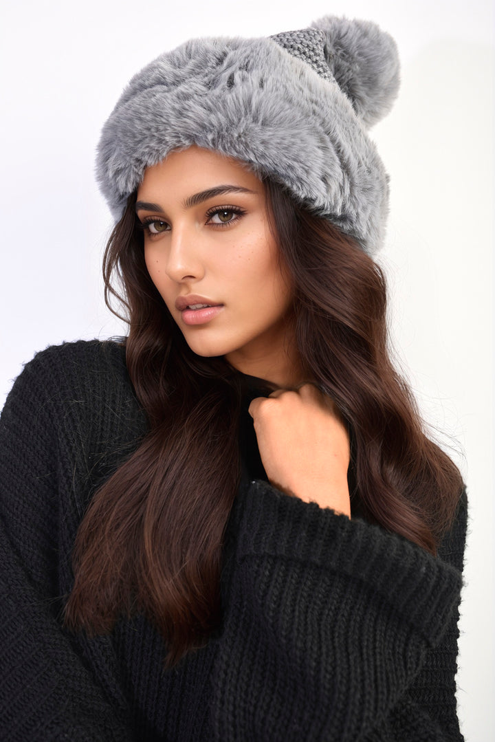 Faux Fur Knitted Winter Hat on woman, showcasing its plush faux fur and chic knitted design, perfect for stylish warmth.