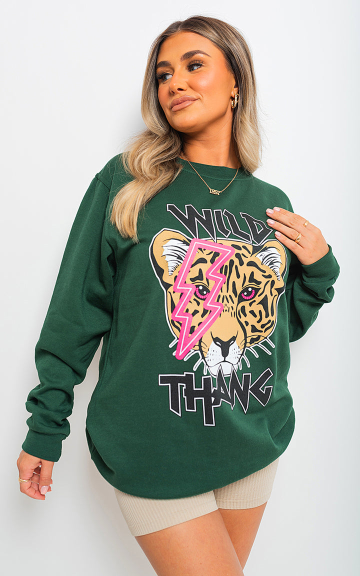 Woman wearing the Wild Thang Tiger Print Knitted Jumper, showcasing its bold tiger pattern and cozy fit, perfect for stylish and versatile fashion.