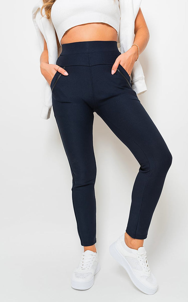 Woman wearing High Waist Double Band Pocket Leggings with hands on hips, showcasing stylish design and functionality, perfect for workouts and casual wear.