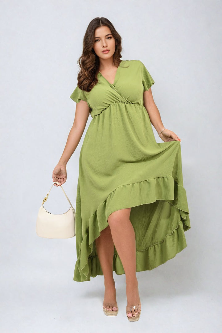 Woman in a green High Low Ruffle Hem Maxi Dress, holding a white purse with a gold chain, showcasing elegance and style for any occasion.