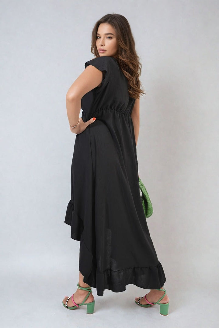 Woman in a High Low Ruffle Hem Maxi Dress, showcasing elegant movement and flattering silhouette, ideal for stylish occasions.