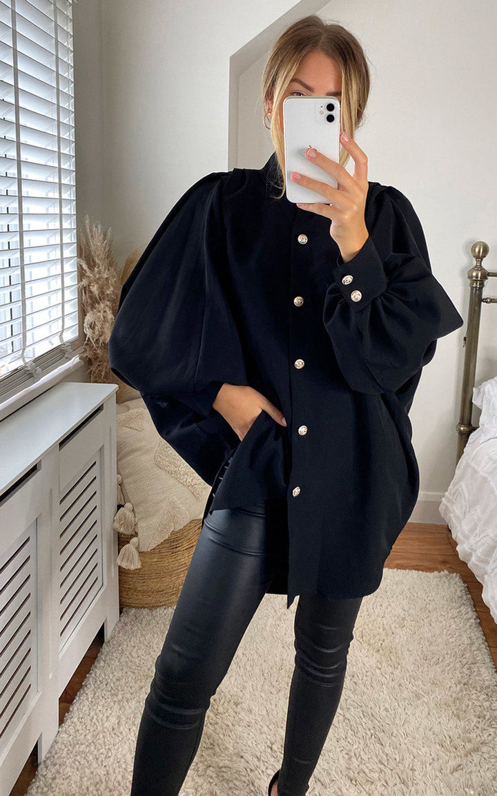 Woman taking a selfie in an Oversized High Neck Shirt, showcasing its relaxed fit and versatile style, ideal for casual or sophisticated looks.