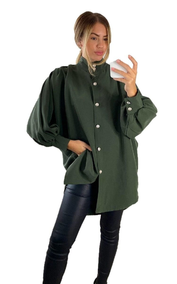 Oversized High Neck Shirt: Woman in stylish oversized shirt, capturing a selfie, showcasing the shirt's relaxed fit and versatility for casual or elevated looks.