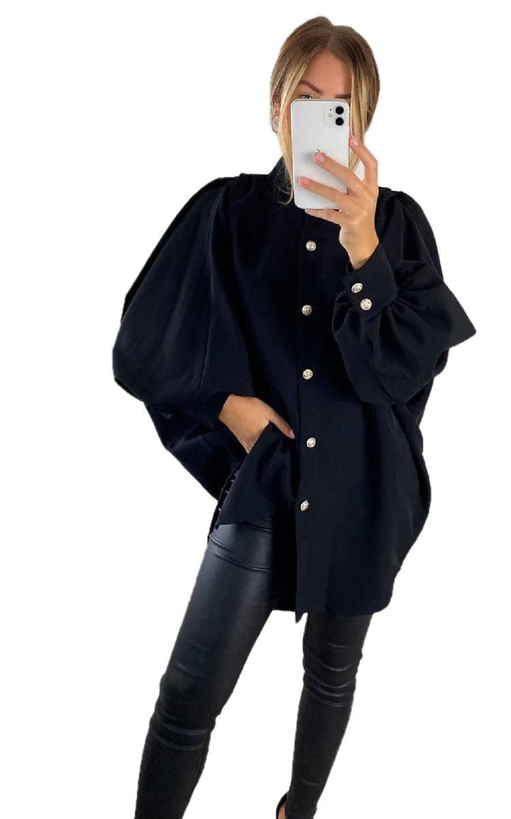 Woman taking a selfie in an oversized high-neck shirt, showcasing its relaxed fit and comfortable fabric, ideal for stylish, everyday wear.