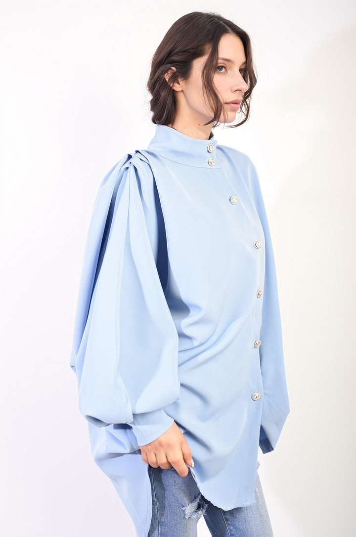 Oversized High Neck Shirt featuring a relaxed fit and high-neck design, worn by a woman, showcasing casual elegance perfect for versatile styling.