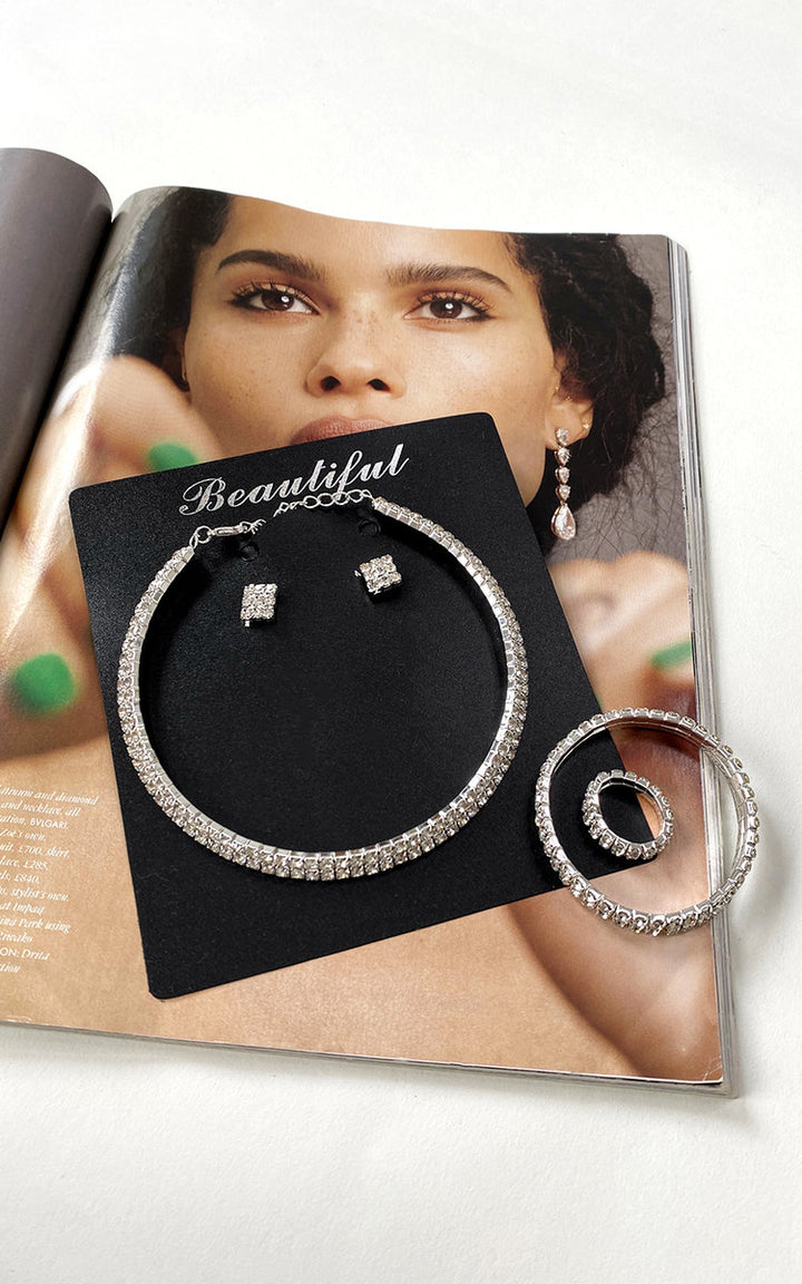 Claire Diamante Ring Bracelet displayed elegantly on a black card, featuring cubic zirconia stones, perfect for enhancing any outfit with its versatile charm.