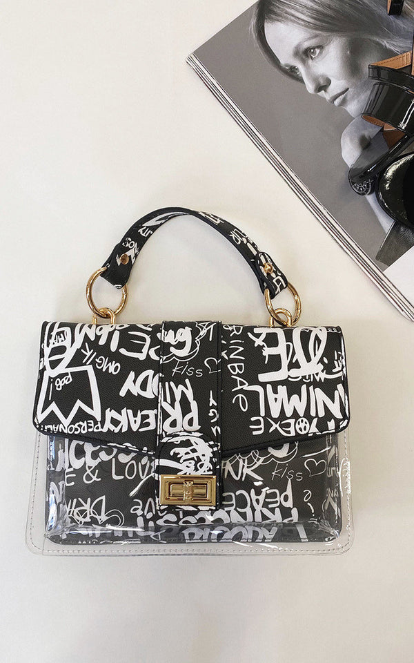 Graffiti Print Handbag with black and white design, featuring faux leather and a clasp fastening, perfect for everyday use.