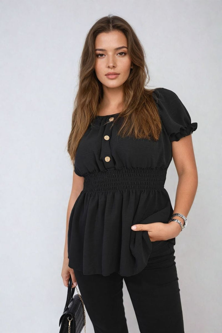 Woman wearing the Daniela Button Front Cinched Waist Top, showcasing its flattering adjustable waist and stylish button front design.