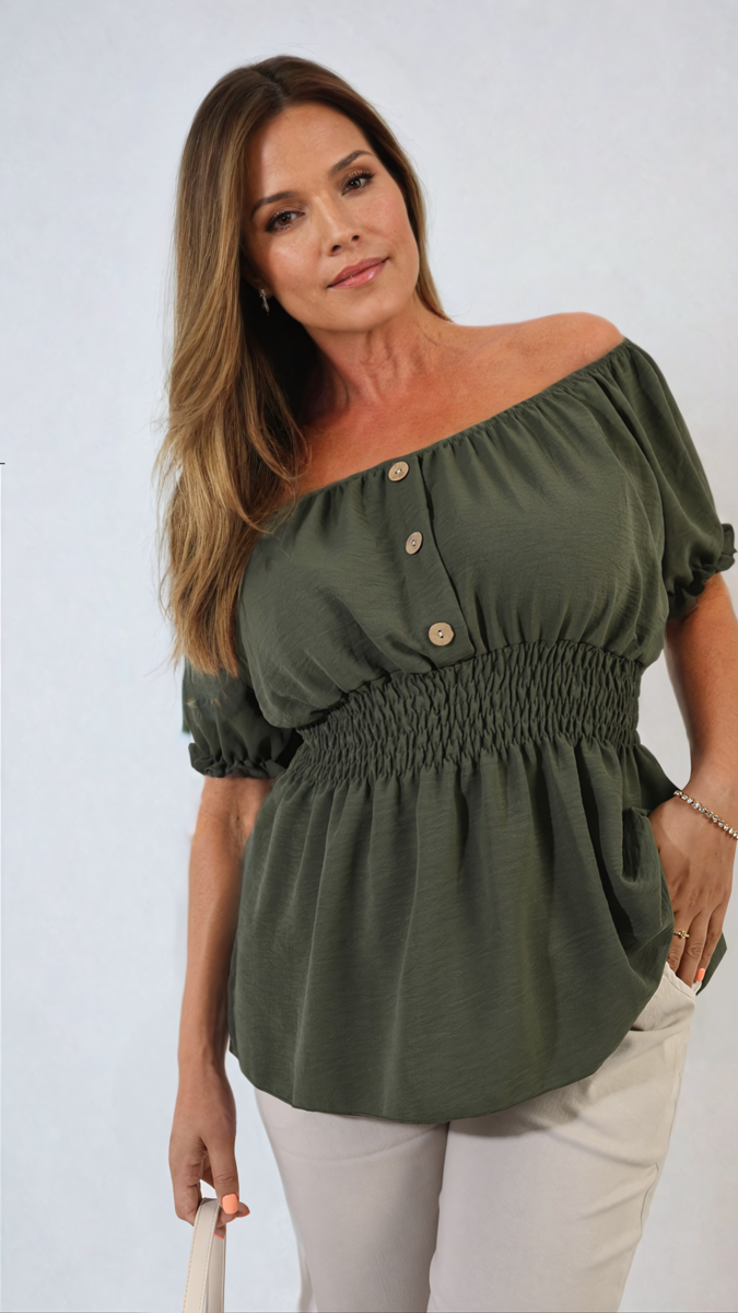 Woman wearing the Daniela Button Front Cinched Waist Top, showcasing its flattering fit and chic button details, perfect for stylish everyday wear.