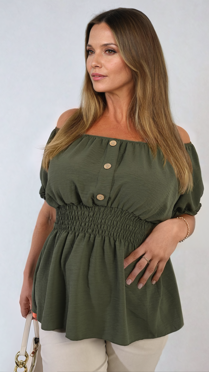 Woman wearing the Daniela Button Front Cinched Waist Top, showcasing its figure-flattering design and stylish button details, perfect for versatile, chic wear.