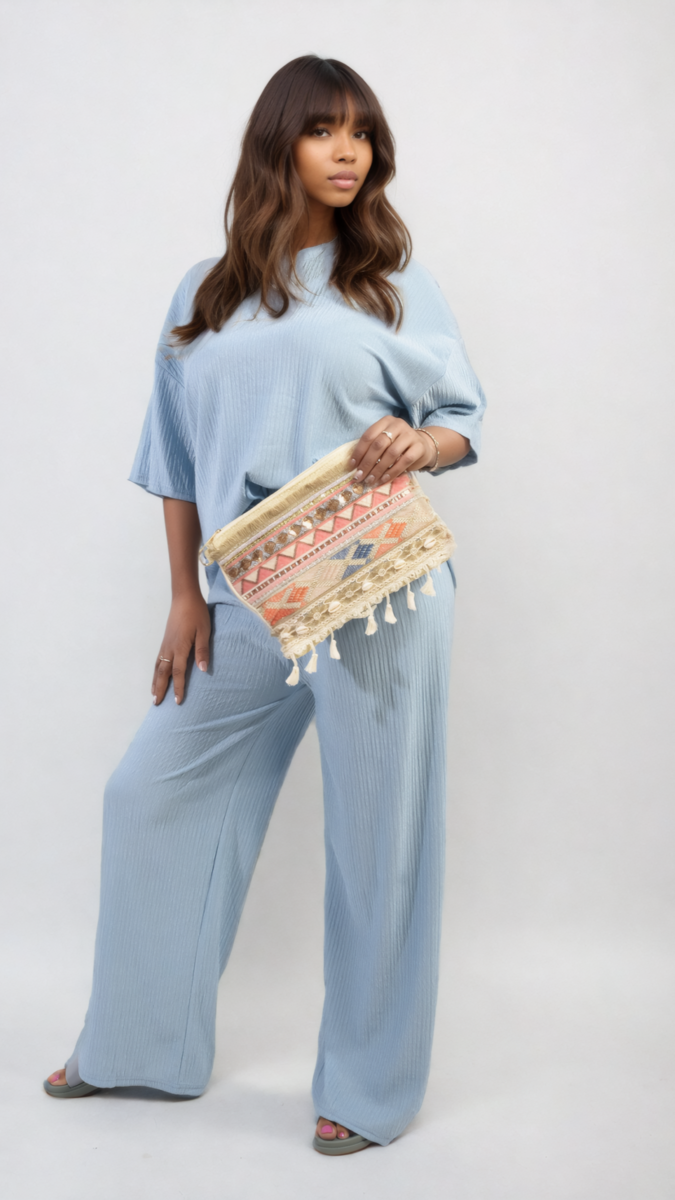 Woman modeling Ribbed Oversized Top and Drawstring Wide Leg Trouser Co-ord Set, showcasing its comfortable, stylish design ideal for laid-back days.