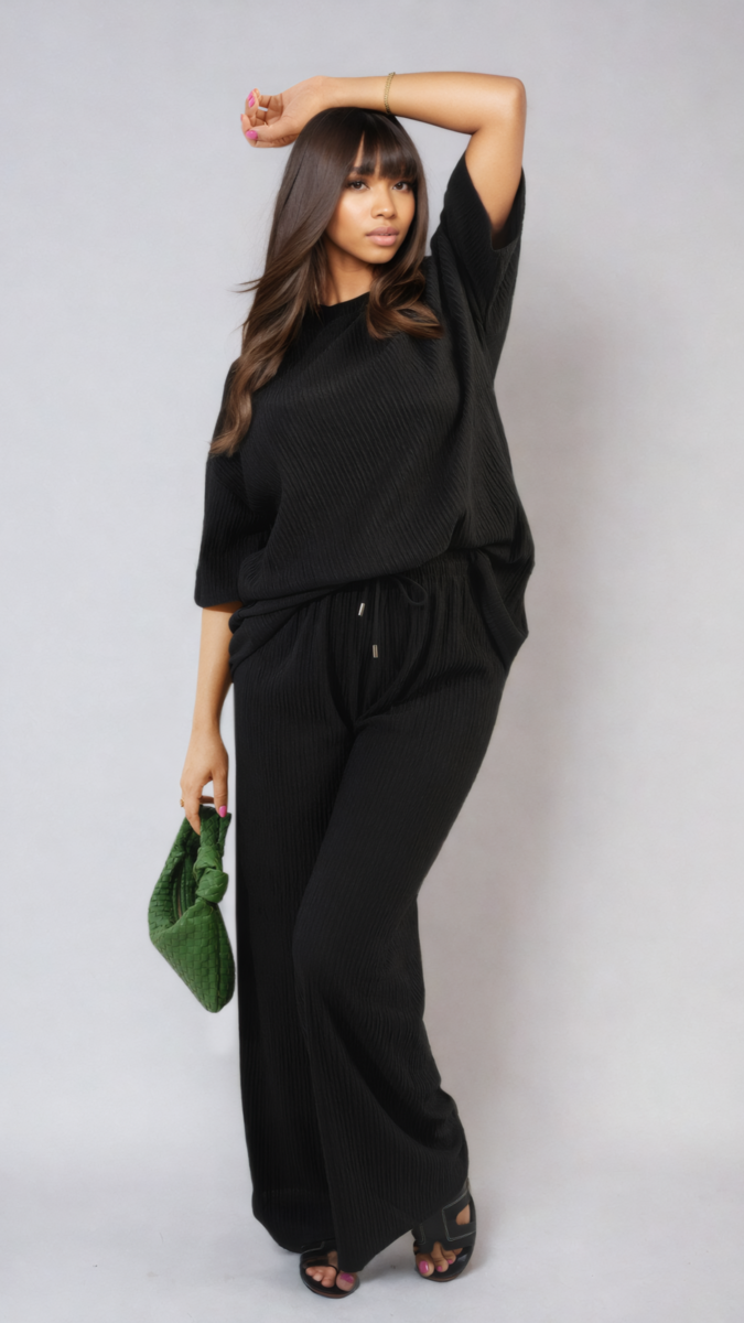 Woman wearing Ribbed Oversized Top and Drawstring Wide Leg Trouser Co-ord Set, showcasing a stylish and comfortable outfit, perfect for casual, laid-back days.