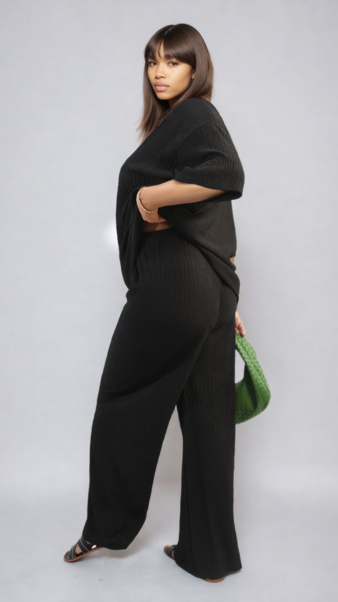 Woman wearing Ribbed Oversized Top and Drawstring Wide Leg Trouser Co-ord Set, showcasing its relaxed fit and stylish design. Perfect for casual, chic looks.