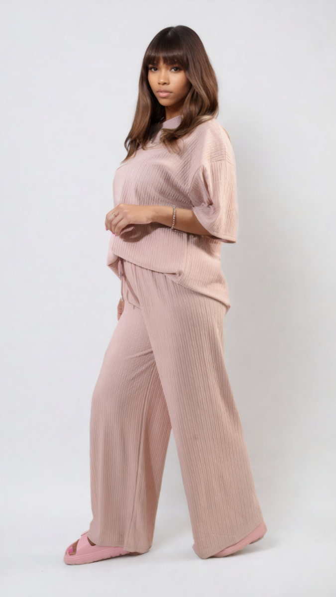 Ribbed Oversized Top and Drawstring Wide Leg Trouser Co-ord Set modeled by a woman, showcasing comfortable, stylish design for laid-back days.