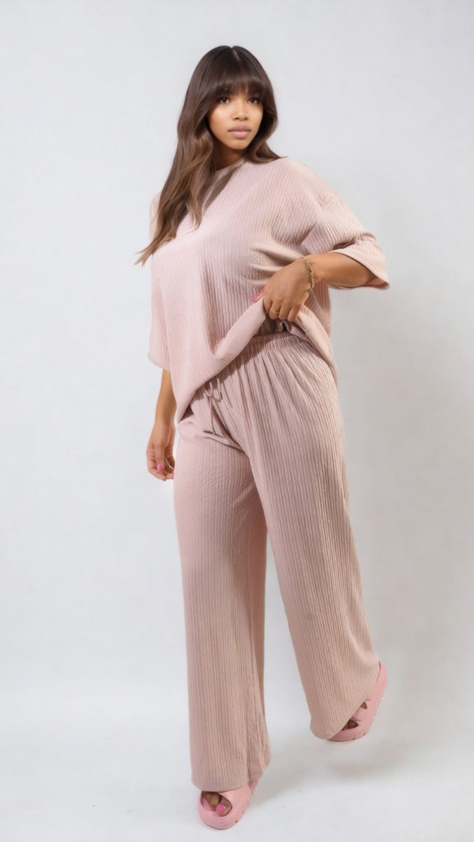 Woman wearing the Ribbed Oversized Top and Drawstring Wide Leg Trouser Co-ord Set, showcasing comfortable and stylish holiday clothing from Holiday Clothes UK.