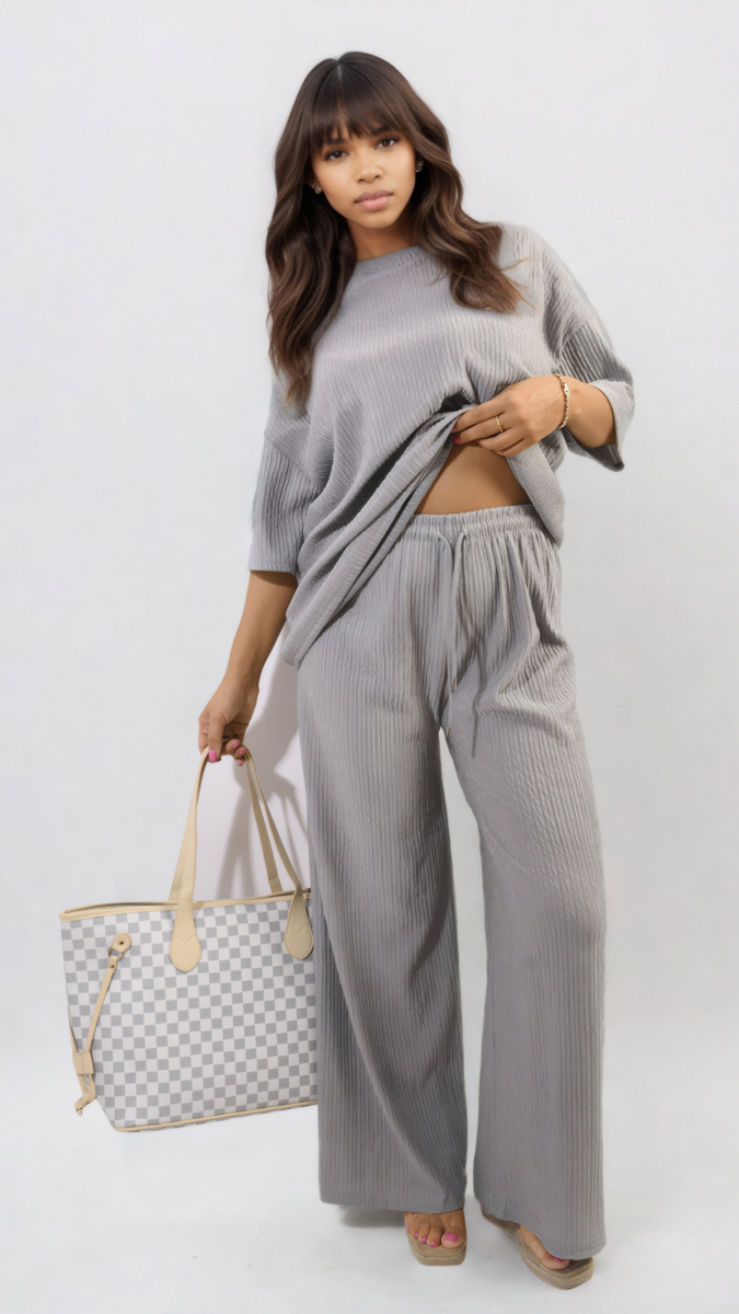 Woman holding Ribbed Oversized Top and Drawstring Wide Leg Trouser Co-ord Set, showcasing its comfy chic style and casual fashion appeal.