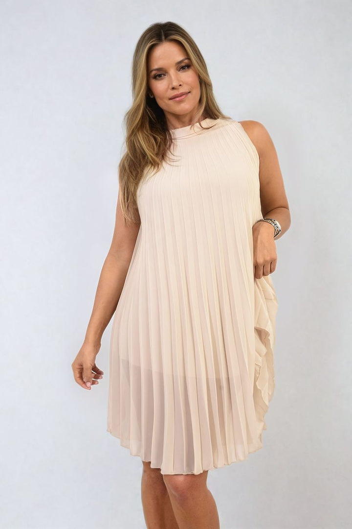 Woman wearing Davina Pleated Halter Neck Mini Dress, showcasing its elegant pleated design and halter neckline, perfect for stylish holiday occasions.