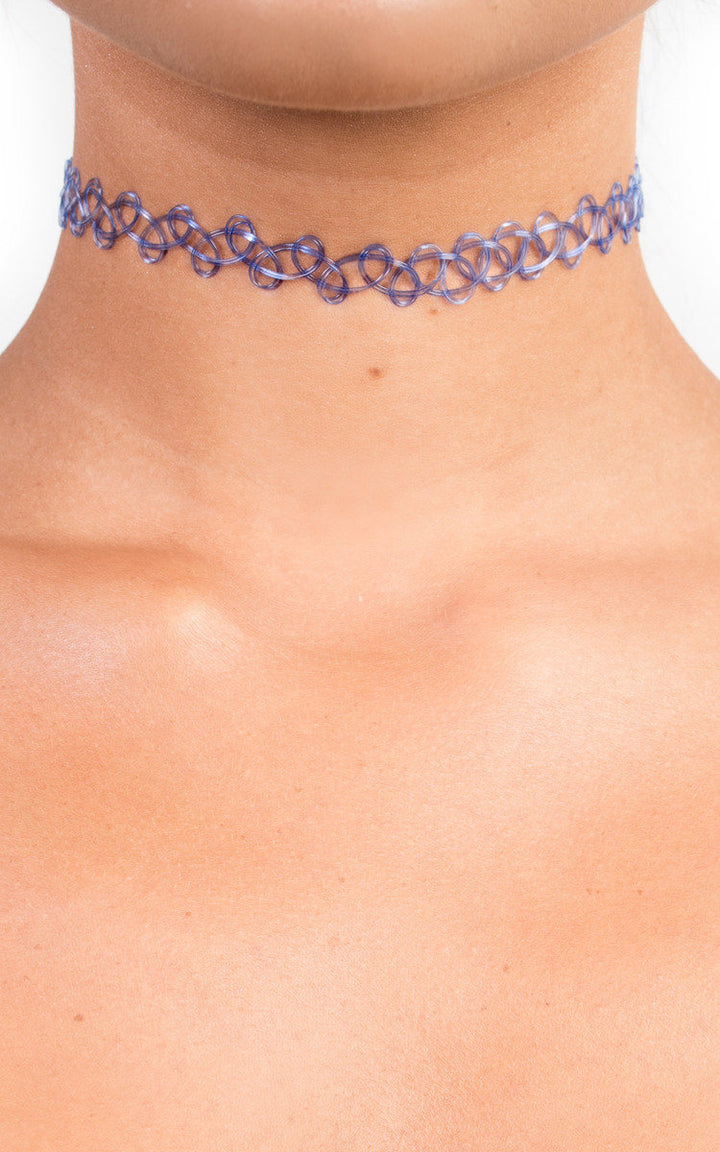 Close-up of a Stretch Choker, a stylish fashion accessory, ideal for adding an edgy touch to casual outfits like oversized t-shirts and denim.