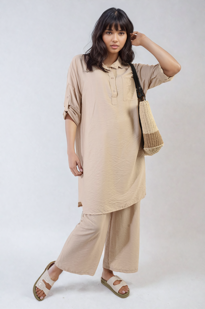 Woman wearing the Dulce Oversized Button Front Shirt & Wide Leg Pants Co-ord Set, highlighting casual, stylish comfort for a relaxed, everyday look.